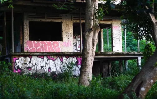 Graffiti on an abandoned building in Kep, from Ines Sothea’s film